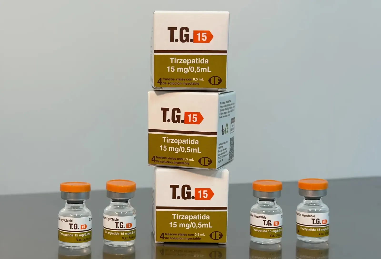 Caixas de TG 15 Tirzepatida 15 mg com faixa oliva e frascos de tampa laranja